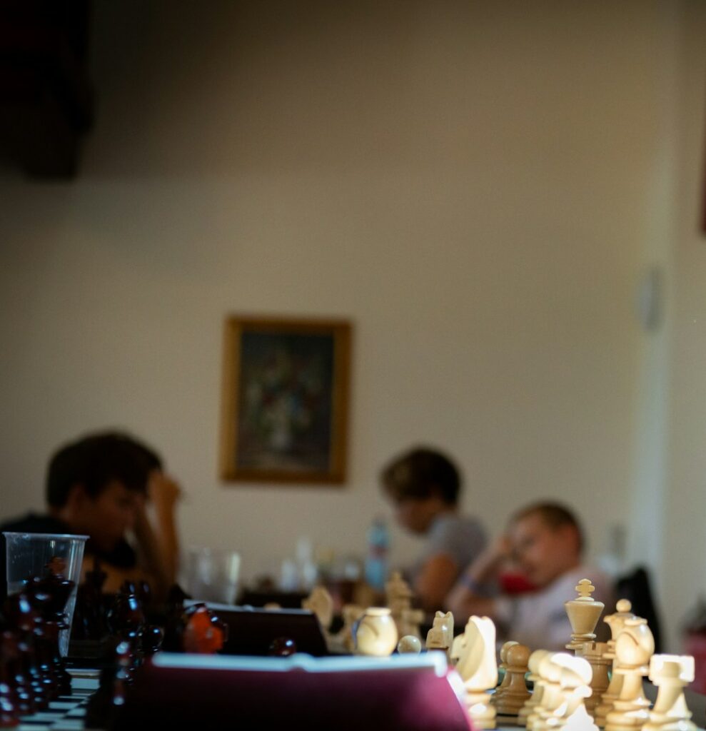 boy in green crew neck shirt sitting on chair